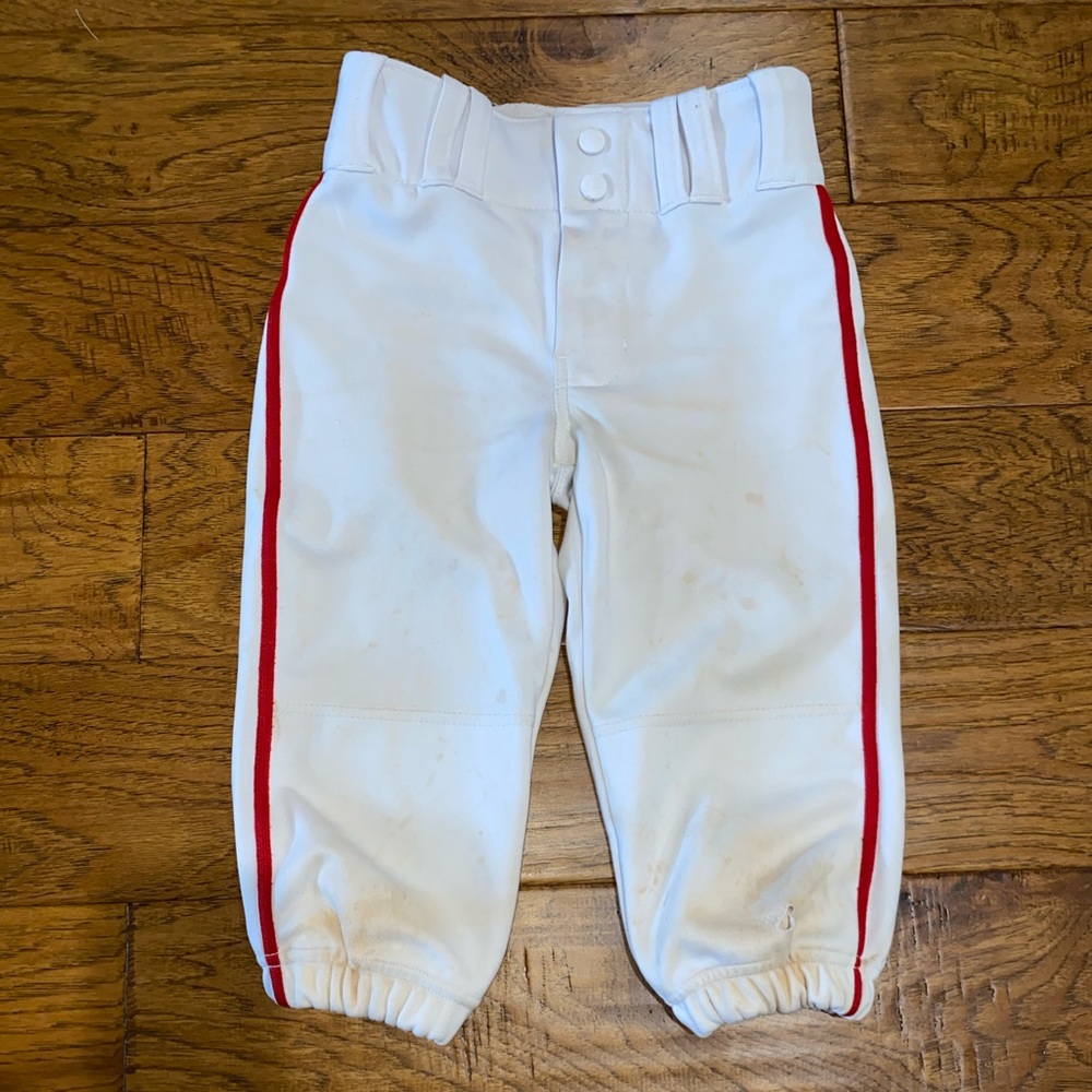 Youth baseball pants with red piping
